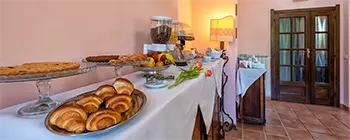 Breakfast buffet with sweet and savory options.